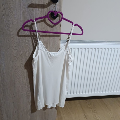 White sleeveless top with silver details