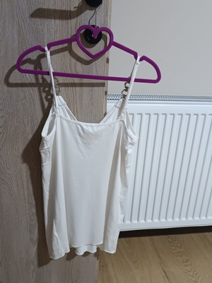 White sleeveless top with silver details