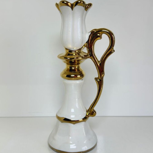 Ceramic candlestick with gold details and floral cross design