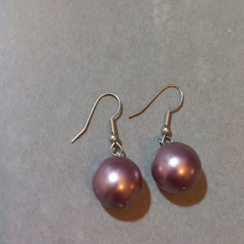Dangling earrings used with purple and silver beads