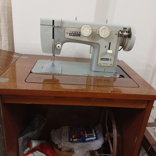 Russian Chaika Sewing Machine used with cabinet and accessories