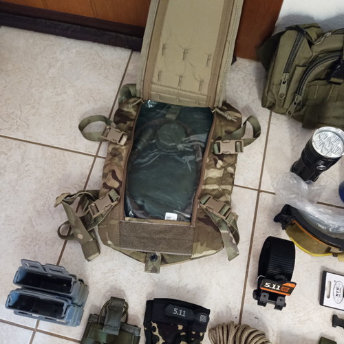 Tactical pack used, assorted gear items
