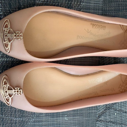 Ballerina shoes used with ink mark on one shoe