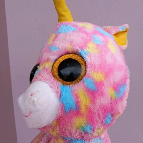 Plush unicorn used, very large, colorful with glass eyes