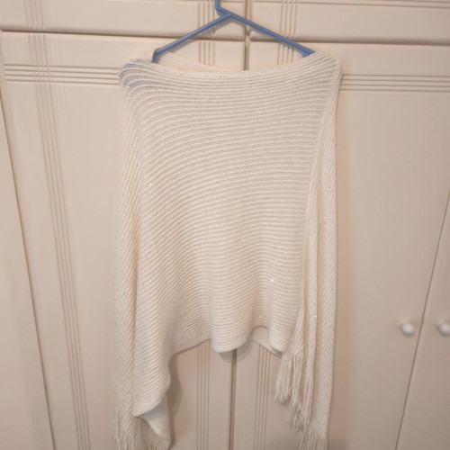 Beige knitted poncho with fringes, size Small