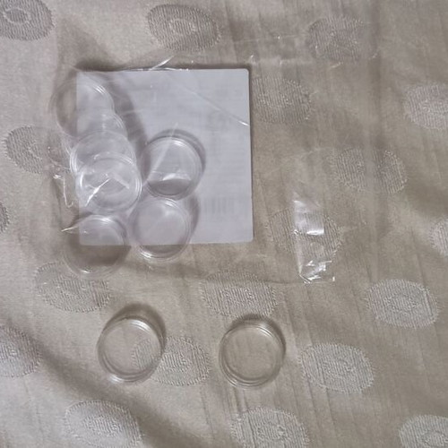 Coin holders new, 20 plastic with 4 cm radius and 9 with 2 cm radius