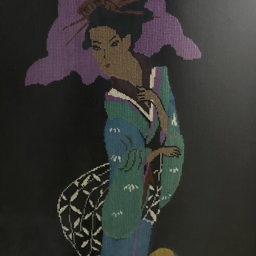 Textile painting with embroidered design used