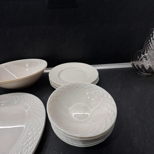 Porcelain dinnerware set with embossed design, like new