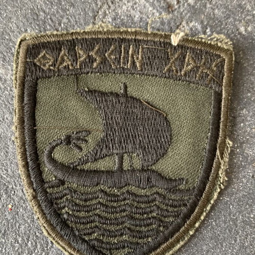 Military insignia used, as shown