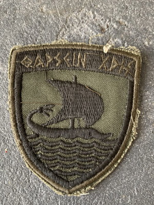 Military insignia used, as shown