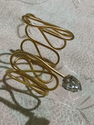 Large gold-tone bracelet with unique design