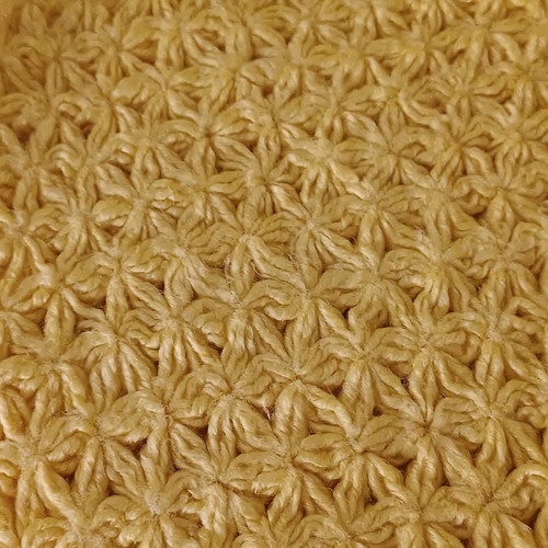 Handmade knitted yellow blanket used