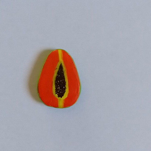 Handmade papaya magnet from clay
