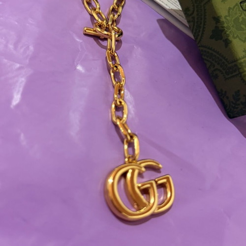 Gucci gold necklace with large GG pendant and chain, new
