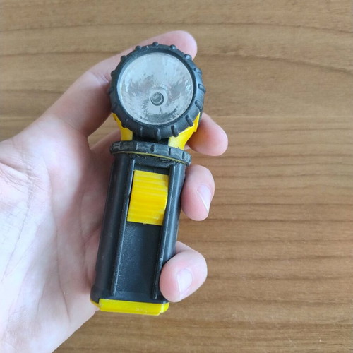 Portable flashlight with adjustable head used