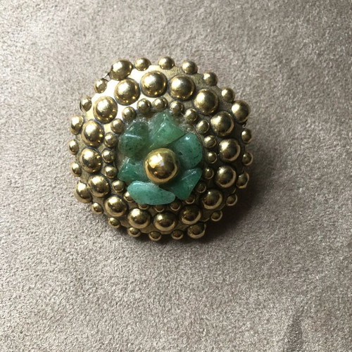 Vintage brooch like new with gold elements and green semi-precious stones