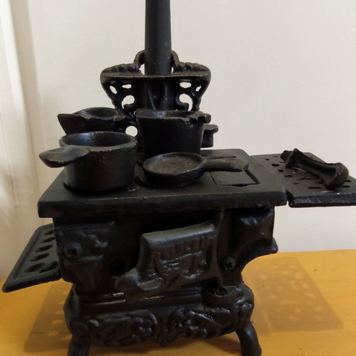 Miniature wooden stove with cast iron accessories like new