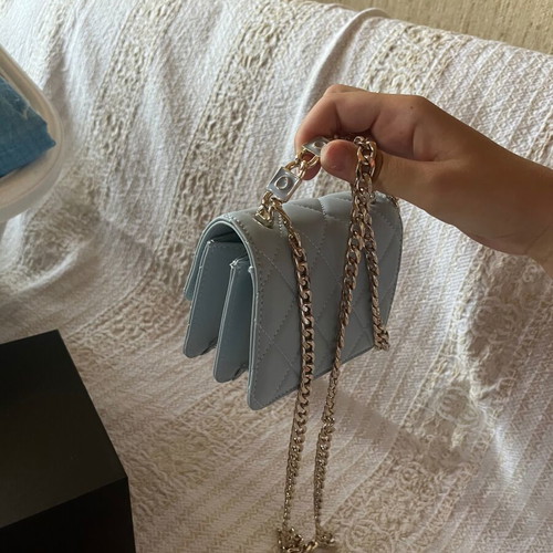 Leather baby blue handbag like new with gold chain and full packaging