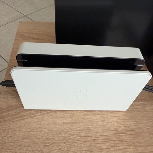 Nintendo Switch OLED like new with accessories and two games