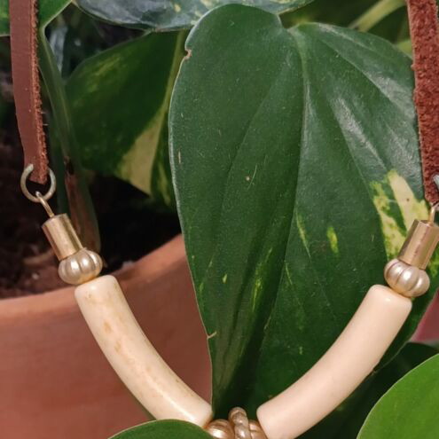 Ethnic necklace with brown leather cord and elephant pendant, vintage bakelite