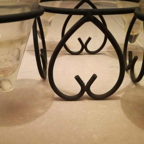 Metal candle holder used for four tealight candles