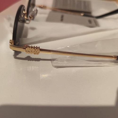 Miu Miu sunglasses women like new, black and gold