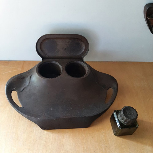 Vintage metal inkwell with ink bottle used