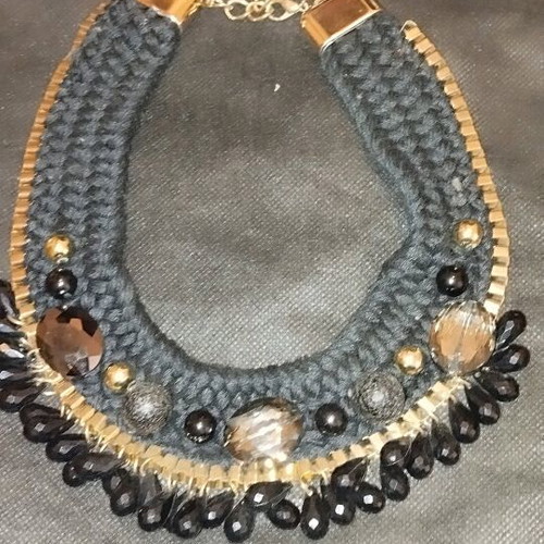Knitted necklace new with black and gold beads