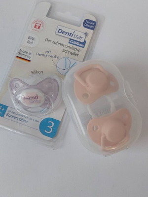 Set of new baby pacifiers and soothers