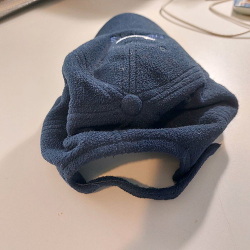 Fleece jockey hat like new, dark blue with national emblem