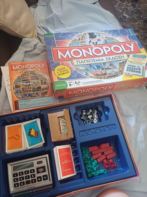 Monopoly Παγκόσμια Έκδοση Here and Now επιτραπέζιο παιχνίδι με ηλεκτρονική τράπεζα για ανταλλακτικά