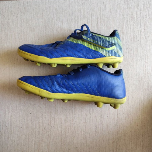 Kipsta kids football shoes used, size 32, blue and yellow