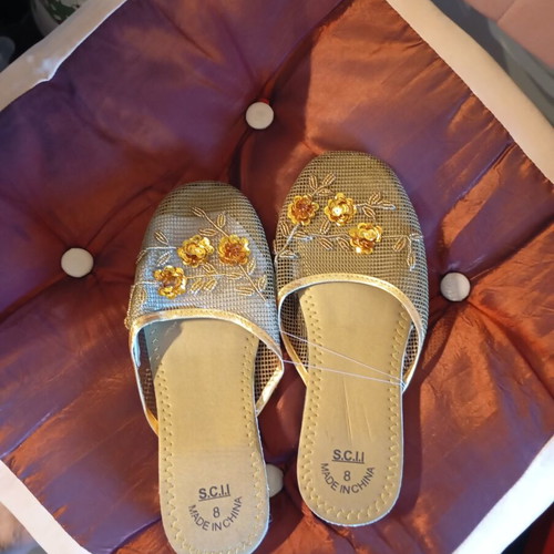 Slippers new, gold color