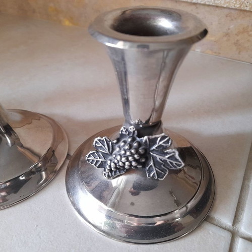 Silver candlestick set used with grape decoration