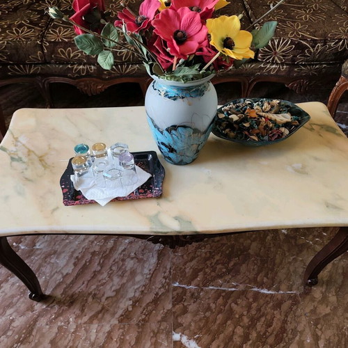 Classic living room refurbished with sofa, armchairs, chairs and marble tables