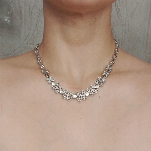 Riviera necklace with flower and four-leaf motifs, silver