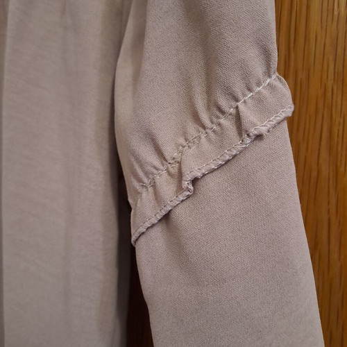 Women's beige shirt with ruffle details, new