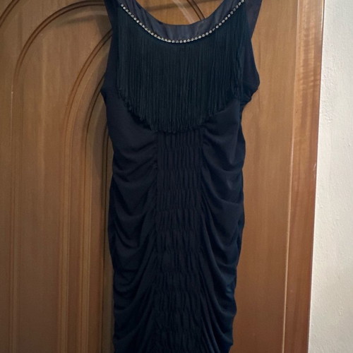 Evening dress used with satin details and fringes