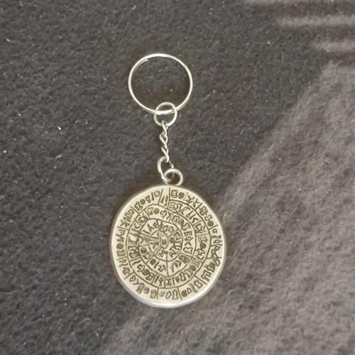 Phaistos Disc keychain used, in excellent condition