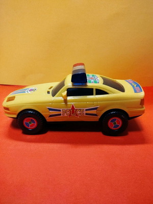 Battery-powered police toy car new, 1980s vintage