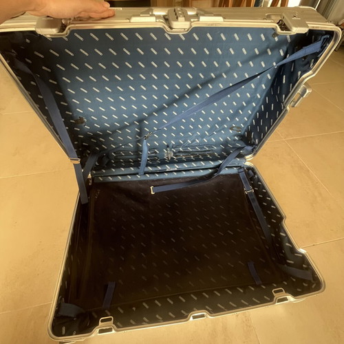 Rimowa travel bag used, silver color, slight defect