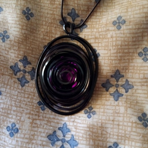 Pendant with long chain used, purple and mirror detail