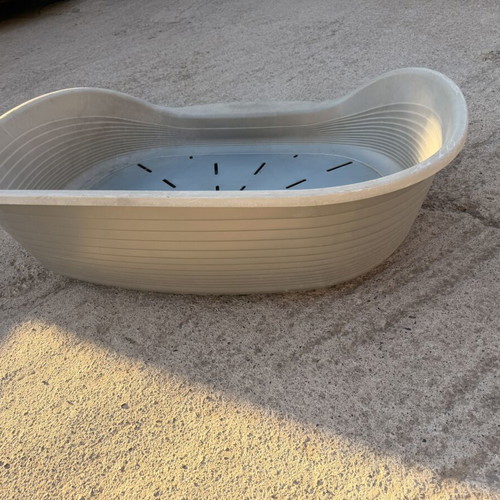 Large plastic dog bed used, outdoor weatherproof