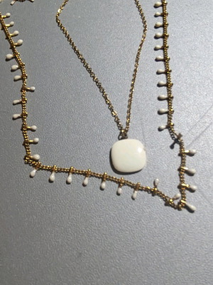 Necklaces with white details set of 2 like new, one gift