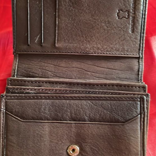 Brown leather wallet used with multiple compartments