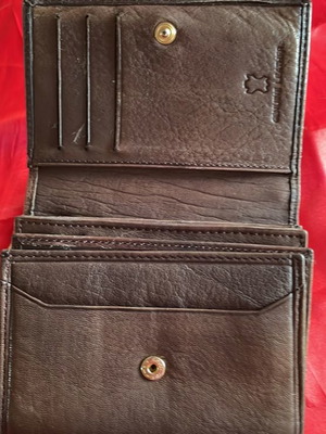 Brown leather wallet used with multiple compartments
