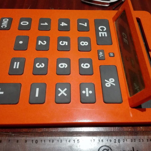 Giant calculator used, orange, A4 size