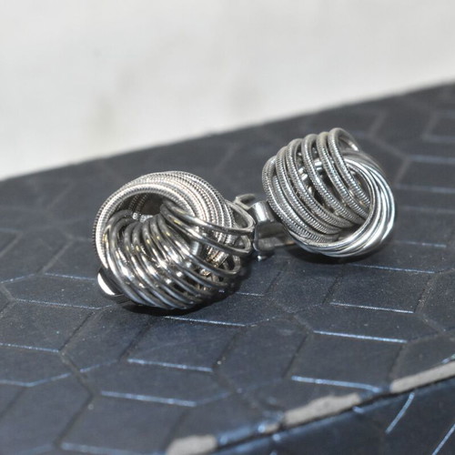 Vintage women's clip-on earrings silver color spiral design used