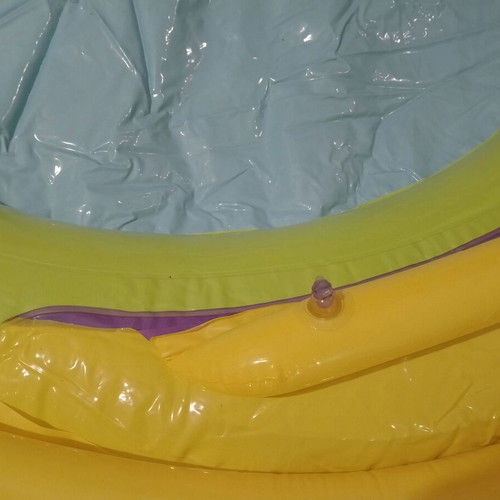 Inflatable colorful playpen used with balls and slides