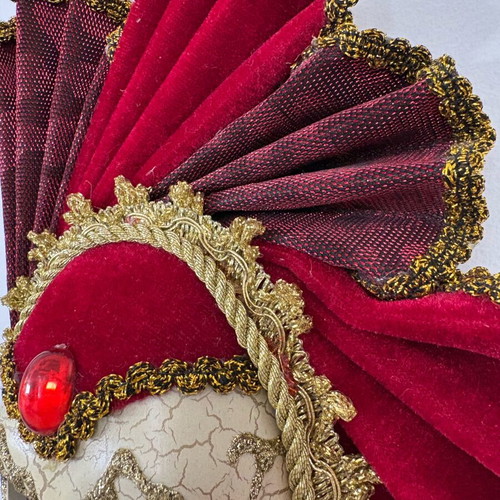 Decorative mask with red velvet details and gold embellishments, like new